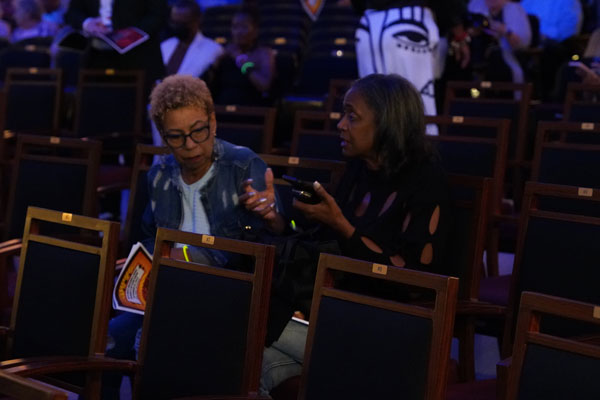 Kathy Burtley and Renita Mays converse before the show.