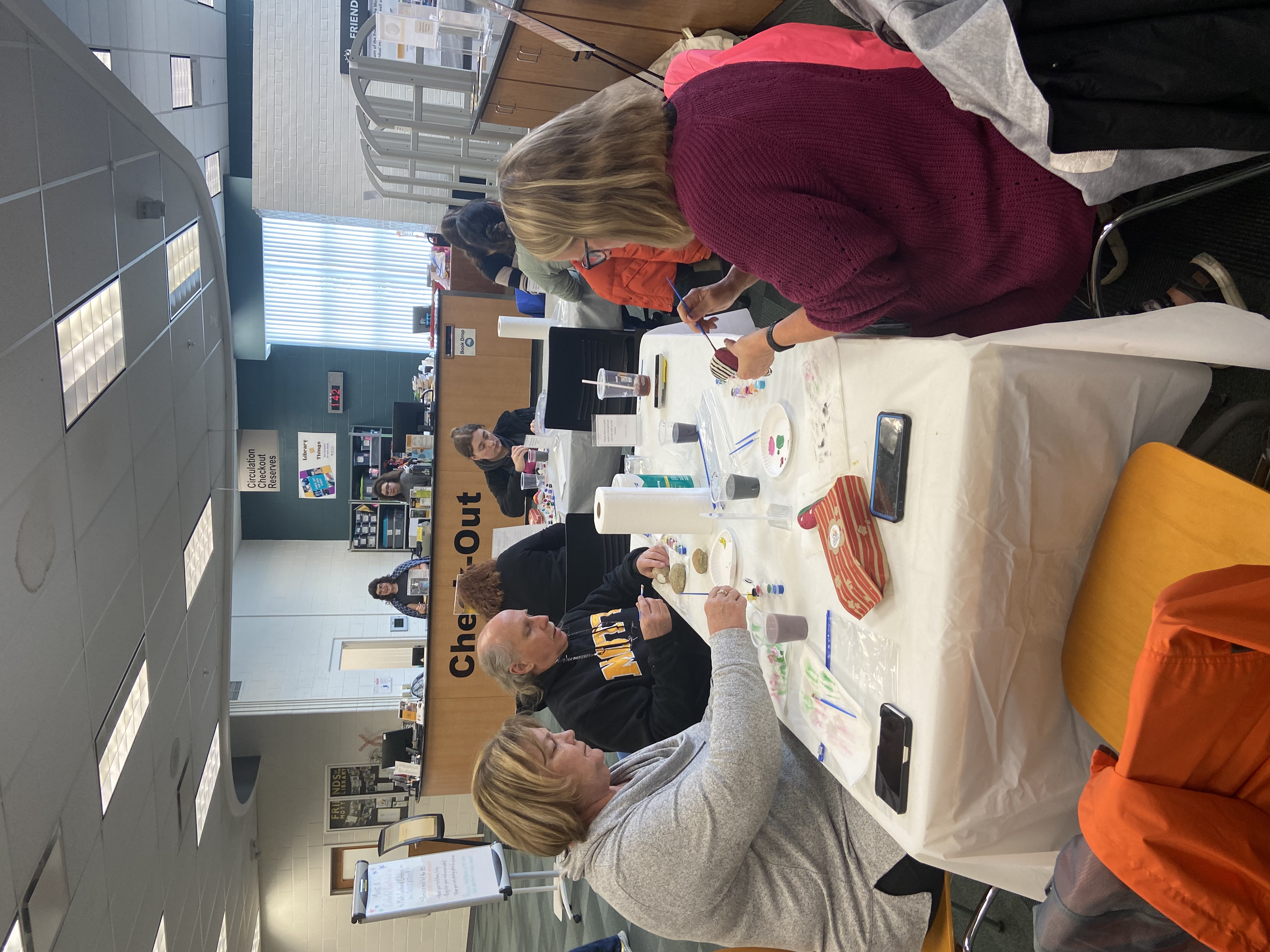 painting Centennial rocks at the library