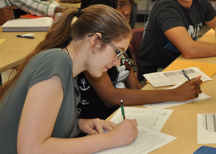 student taking notes