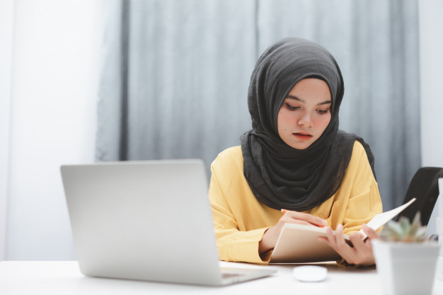 student looking at laptop