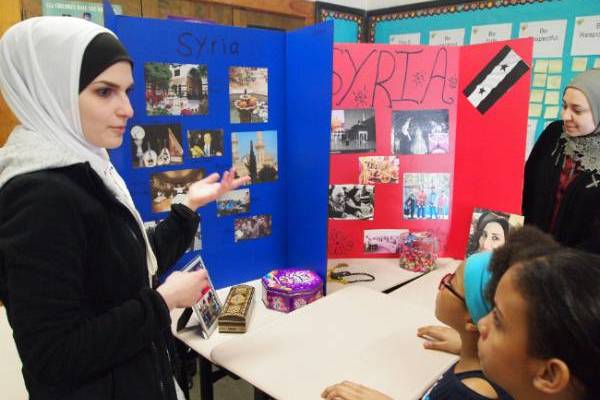 student answering questions from children during information session