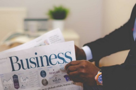 man holding newspaper