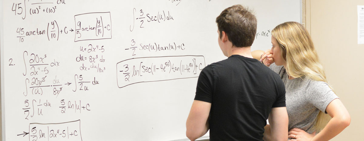 Students working on white board in Study Center