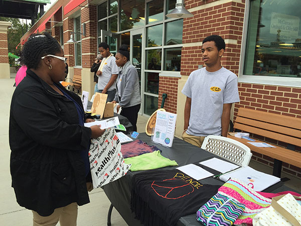 Photo of Teen participants engaging with business patrons